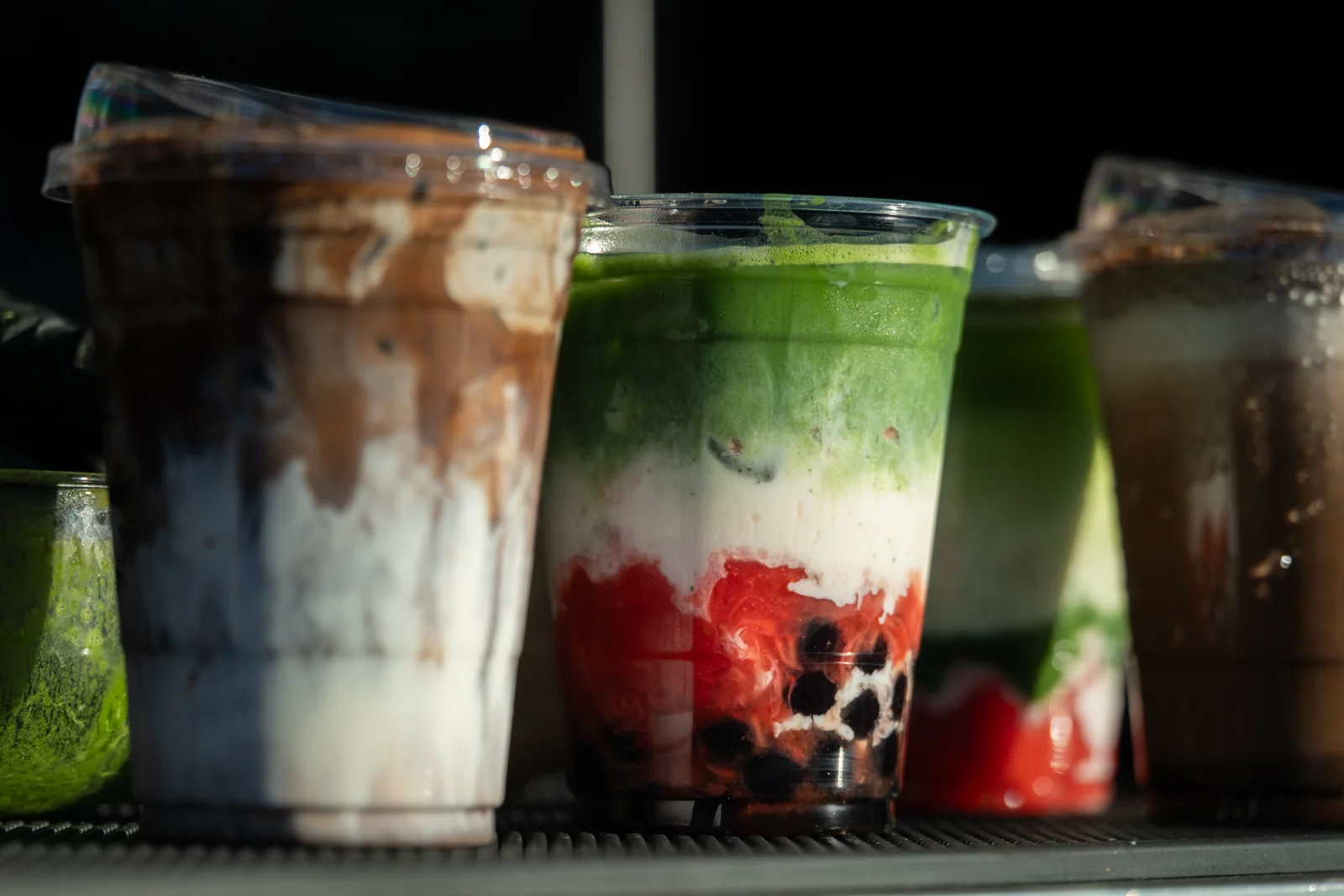 Layered matcha and hojicha drinks