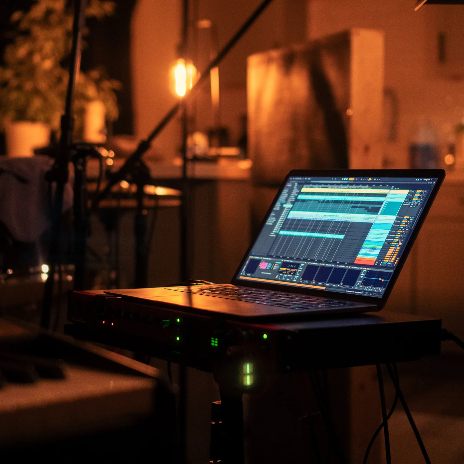 Recording equipment beside a grand piano